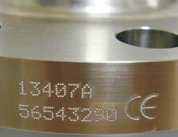 Serial number and CE mark dot pin engraved on a cylindrical component